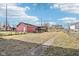 Large backyard featuring a detached garage with a spacious lawn and fenced perimeter offering privacy at 2114 N Dexter St, Indianapolis, IN 46202