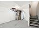 Image shows the basement with exposed pipes and stairs to the right of the image at 2114 N Dexter St, Indianapolis, IN 46202