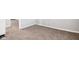 View of bedroom featuring neutral carpet, baseboards, and a door to a different room at 2114 N Dexter St, Indianapolis, IN 46202