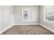 Cozy bedroom featuring neutral carpeting, a window, and crisp, neutral paint at 2114 N Dexter St, Indianapolis, IN 46202