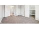 Shot of carpeted bedroom with white trim, two doors, and gray walls at 2114 N Dexter St, Indianapolis, IN 46202
