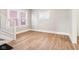 Bright living room with modern flooring, fresh paint, and a staircase to the second floor at 2114 N Dexter St, Indianapolis, IN 46202