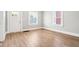 Inviting living room with modern flooring, crisp paint, and abundant natural light at 2114 N Dexter St, Indianapolis, IN 46202