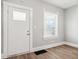 Bright living room features wood floors, freshly painted walls and white trim at 2114 N Dexter St, Indianapolis, IN 46202