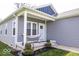 Inviting front porch with a comfortable hammock, decorative plants, and charming details at 2239 E Werges Ave, Indianapolis, IN 46237