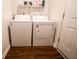 Laundry room with washer and dryer, and laminate floor at 2239 E Werges Ave, Indianapolis, IN 46237