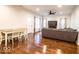 Open-concept living room featuring hardwood floors, a dining area, and a cozy seating area at 2239 E Werges Ave, Indianapolis, IN 46237