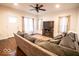 Inviting living room with a large sofa, a ceiling fan, and ample natural light at 2239 E Werges Ave, Indianapolis, IN 46237