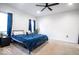 Brightly lit bedroom featuring a ceiling fan, plush carpeting, and neutral color palette at 2239 E Werges Ave, Indianapolis, IN 46237