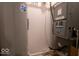 Utility area featuring a water heater and furnace system at 2239 E Werges Ave, Indianapolis, IN 46237