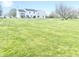 Expansive backyard featuring a well-manicured lawn and mature tree at 2303 Cole Wood Ct, Indianapolis, IN 46239