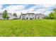 Large, level backyard featuring a white house with a patio, ideal for outdoor activities at 2303 Cole Wood Ct, Indianapolis, IN 46239