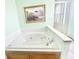 Bathroom with a large soaking tub and a separate glass-enclosed shower at 2303 Cole Wood Ct, Indianapolis, IN 46239
