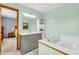 The bathroom offers a marble sink, toilet and built-in shelving at 2303 Cole Wood Ct, Indianapolis, IN 46239
