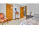 This bedroom has a reading chair with a unique table and two closets at 2303 Cole Wood Ct, Indianapolis, IN 46239