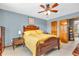 This is a bedroom with a large wooden bed and matching nightstand at 2303 Cole Wood Ct, Indianapolis, IN 46239