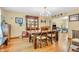 Elegant dining room with hardwood floors, a large wooden table, and a decorative hutch at 2303 Cole Wood Ct, Indianapolis, IN 46239
