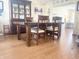 Cozy dining room with a large wood table, hutch, and hardwood floors, perfect for Gathering gatherings at 2303 Cole Wood Ct, Indianapolis, IN 46239