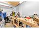 Well-organized garage featuring workbenches, ample storage, and a functional layout at 2303 Cole Wood Ct, Indianapolis, IN 46239