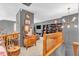 Cozy hallway with wooden railings, gray walls, and views to the living area at 2303 Cole Wood Ct, Indianapolis, IN 46239