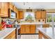 Charming eat-in kitchen with oak cabinets, stainless-steel appliances and bright natural light at 2303 Cole Wood Ct, Indianapolis, IN 46239