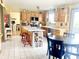 Spacious kitchen with a center island, white cabinets, and modern appliances, perfect for cooking and entertaining at 2303 Cole Wood Ct, Indianapolis, IN 46239