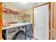 Convenient laundry room with stainless steel washer and dryer, ample counter space, and storage at 2303 Cole Wood Ct, Indianapolis, IN 46239