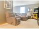 Spacious living room featuring a large sectional sofa and a fun retro arcade game at 2303 Cole Wood Ct, Indianapolis, IN 46239