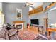 Spacious living room with fireplace, cathedral ceiling, and hardwood floors at 2303 Cole Wood Ct, Indianapolis, IN 46239
