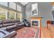 Spacious living room with hardwood floors, fireplace, and lots of natural light at 2303 Cole Wood Ct, Indianapolis, IN 46239