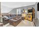 Upper level living space featuring a cozy sofa, decorative accents, and a vintage game at 2303 Cole Wood Ct, Indianapolis, IN 46239