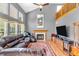 Spacious living room features a fireplace and large windows for natural light at 2303 Cole Wood Ct, Indianapolis, IN 46239