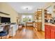 Bright, open office space with hardwood floors, natural light, and ample workspace for creative projects at 2303 Cole Wood Ct, Indianapolis, IN 46239