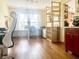 Bright office space with large windows, hardwood floors, and built-in shelving, ideal for remote work at 2303 Cole Wood Ct, Indianapolis, IN 46239