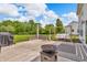 Inviting patio area with a fire pit, swing, and ample space for outdoor entertaining at 2303 Cole Wood Ct, Indianapolis, IN 46239