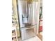Modern stainless steel refrigerator with water dispenser, blending style and functionality in the kitchen at 2303 Cole Wood Ct, Indianapolis, IN 46239