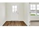 Bright entryway featuring wood-look flooring, a glass door, and views to a window at 2764 Glade Ave, Plainfield, IN 46168