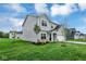 Beautiful single-Gathering home with a manicured lawn, young trees, and gray siding at 2764 Glade Ave, Plainfield, IN 46168