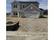 Newly built two story home featuring a two car garage and stone accents near the entryway at 2764 Glade Ave, Plainfield, IN 46168