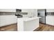 Bright kitchen with white island, countertops, cabinets and stainless steel appliances at 2764 Glade Ave, Plainfield, IN 46168