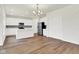 Open kitchen with an island, stainless steel appliances, and hardwood flooring at 2764 Glade Ave, Plainfield, IN 46168