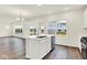 Kitchen featuring island with a sink, modern appliances, and hardwood floors at 2764 Glade Ave, Plainfield, IN 46168