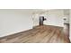 Open living area featuring hardwood floors, white walls, and a modern kitchen at 2764 Glade Ave, Plainfield, IN 46168