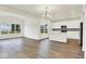 Spacious living room with hardwood floors and plenty of natural light from large windows at 2764 Glade Ave, Plainfield, IN 46168