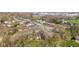 This aerial shot features a residential area with a church and mature trees during early spring at 2815 Kay Ellen Dr, Indianapolis, IN 46229