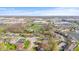 An aerial view showcasing a neighborhood close to commercial businesses on a bright, sunny day at 2815 Kay Ellen Dr, Indianapolis, IN 46229