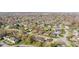 A suburban neighborhood is captured from above, displaying a variety of homes and tree-lined streets at 2815 Kay Ellen Dr, Indianapolis, IN 46229