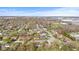 This aerial captures a quiet, residential neighborhood with mature trees and well-maintained streets on a sunny day at 2815 Kay Ellen Dr, Indianapolis, IN 46229