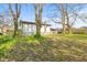 View of home's backyard with a sloped lawn at 2815 Kay Ellen Dr, Indianapolis, IN 46229