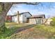 View of home's backyard with lawn and a detached garage at 2815 Kay Ellen Dr, Indianapolis, IN 46229
